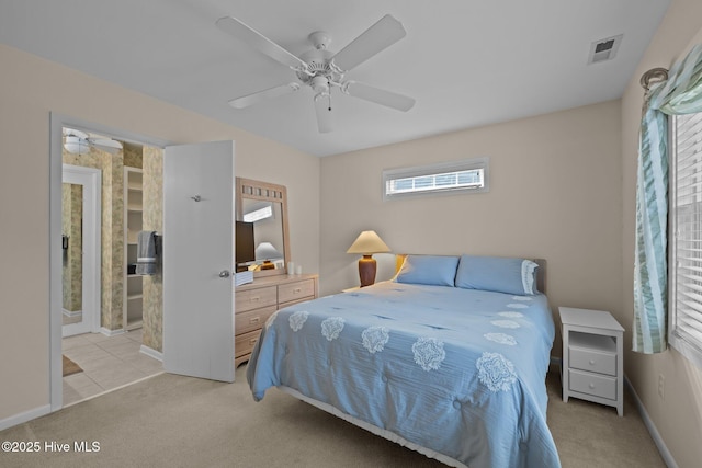 bedroom featuring light carpet and ceiling fan