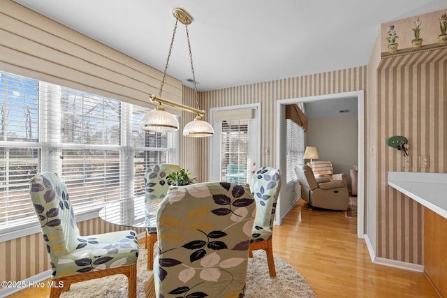 dining space with a healthy amount of sunlight and light wood-type flooring