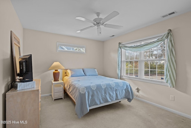 bedroom featuring light carpet and ceiling fan