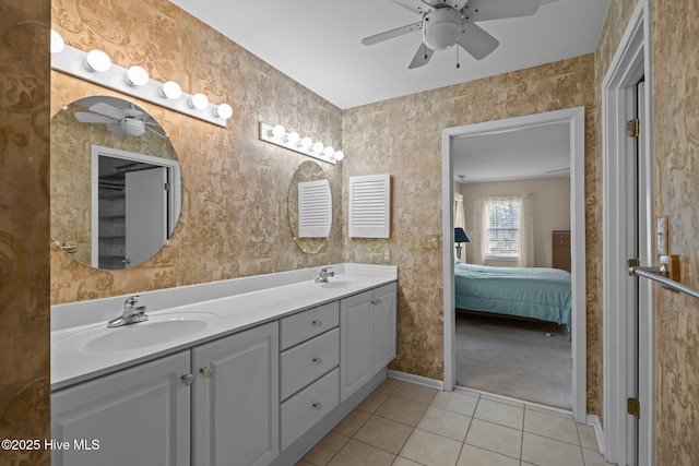 bathroom with tile patterned flooring, vanity, and ceiling fan