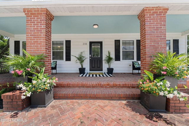 entrance to property with a porch