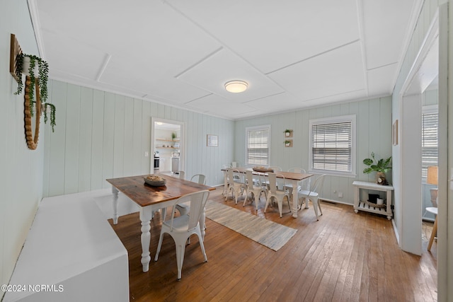 dining space featuring wood-type flooring