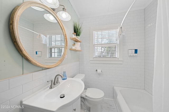 full bathroom featuring tile walls, backsplash, vanity, toilet, and shower / bath combo