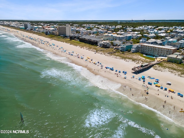 birds eye view of property featuring a water view and a view of the beach