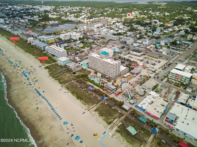 bird's eye view with a water view and a view of the beach