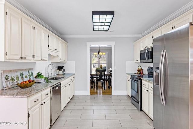 kitchen with sink, white cabinets, stainless steel appliances, crown molding, and light stone countertops