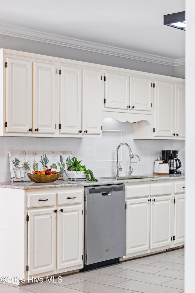 kitchen featuring white cabinetry, dishwasher, and sink