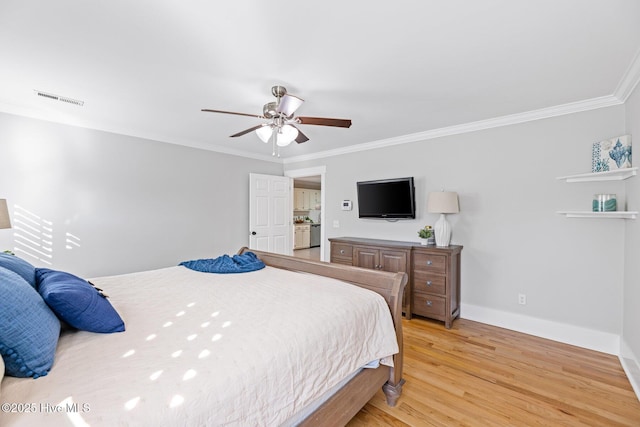 bedroom with ornamental molding, ceiling fan, and light wood-type flooring