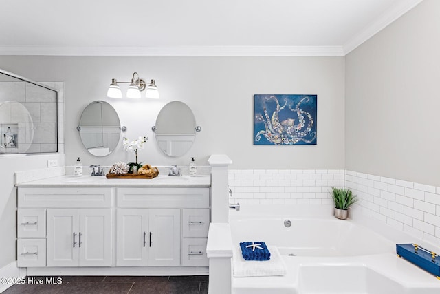 bathroom featuring vanity, a bathtub, ornamental molding, and tile patterned floors