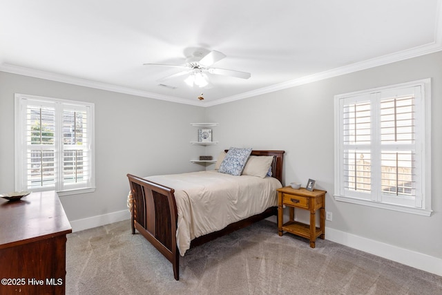 carpeted bedroom featuring ceiling fan, ornamental molding, and multiple windows