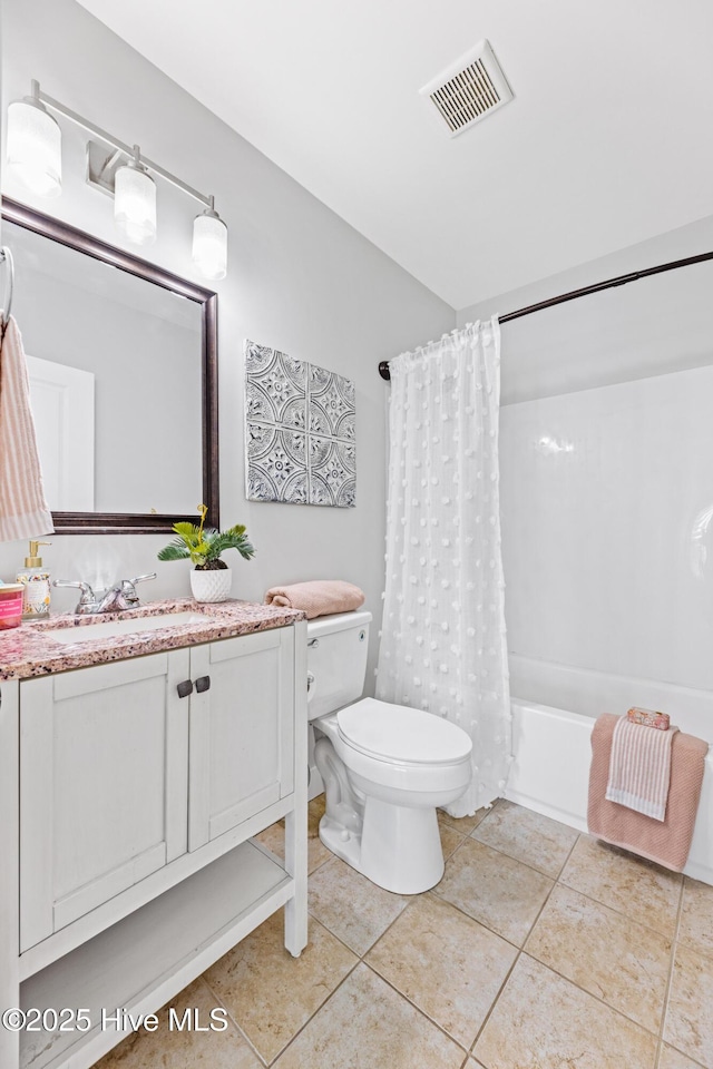 full bathroom featuring shower / bath combination with curtain, tile patterned floors, toilet, and vanity