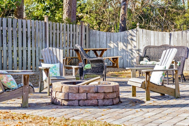 view of patio with a fire pit