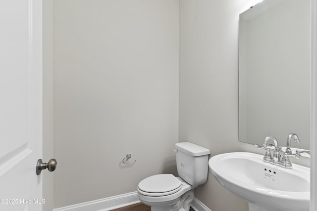 bathroom with sink and toilet