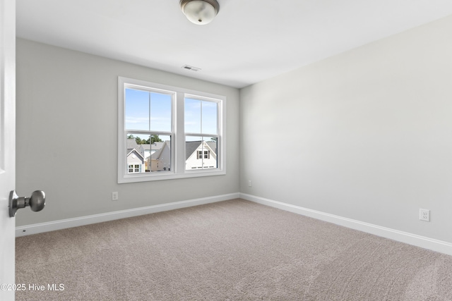 spare room featuring carpet flooring