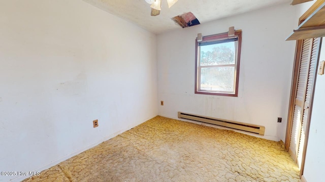 unfurnished bedroom with a baseboard radiator, ceiling fan, and carpet