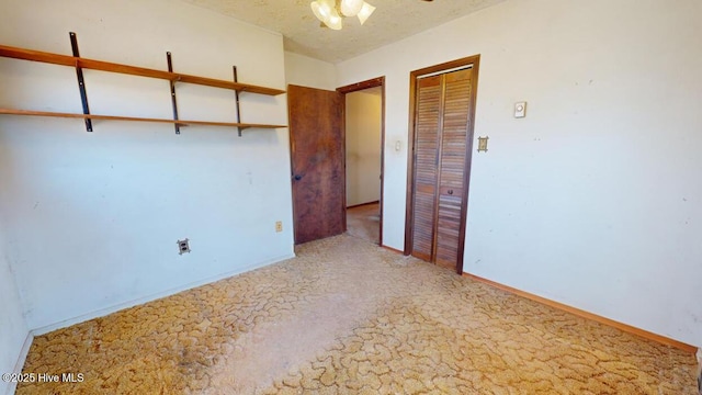 unfurnished bedroom with a textured ceiling