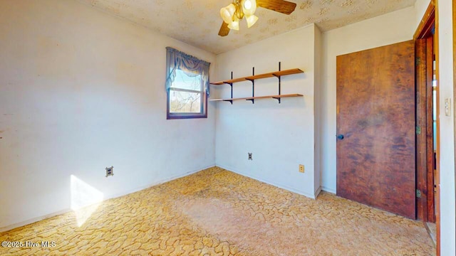 unfurnished room with ceiling fan and light carpet