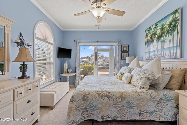 carpeted bedroom featuring crown molding, ceiling fan, and ensuite bathroom