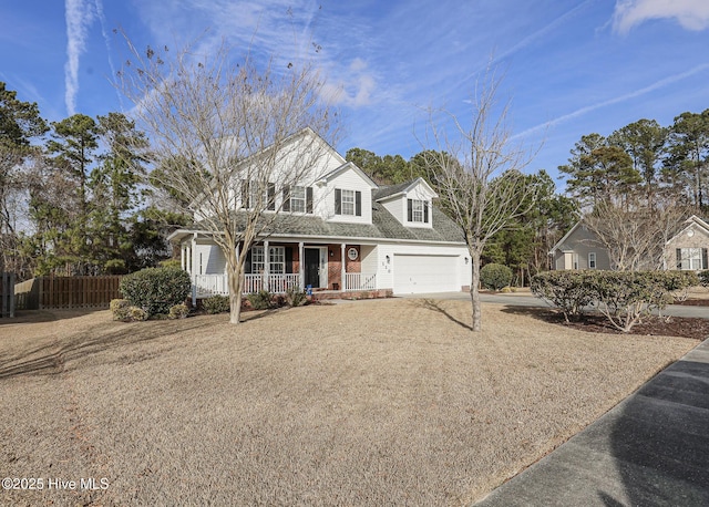 cape cod house with brick siding, covered porch, fence, a garage, and driveway