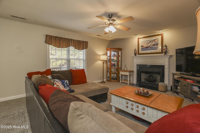 living area with carpet, a fireplace, visible vents, and baseboards