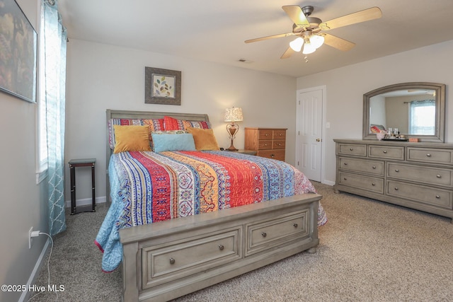 bedroom with carpet, visible vents, ceiling fan, and baseboards