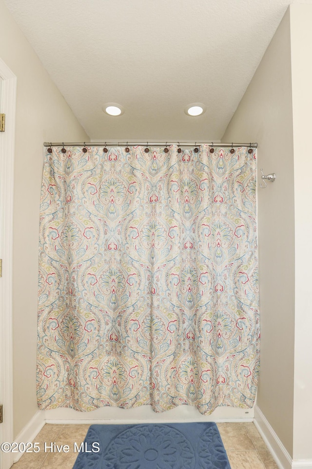 full bathroom featuring tile patterned flooring, baseboards, and recessed lighting