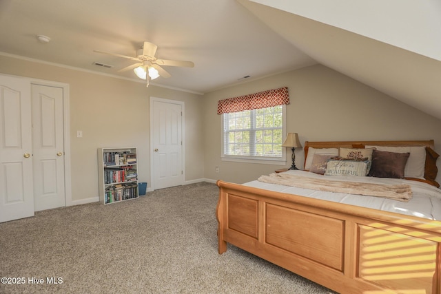 bedroom with lofted ceiling, visible vents, light carpet, and baseboards