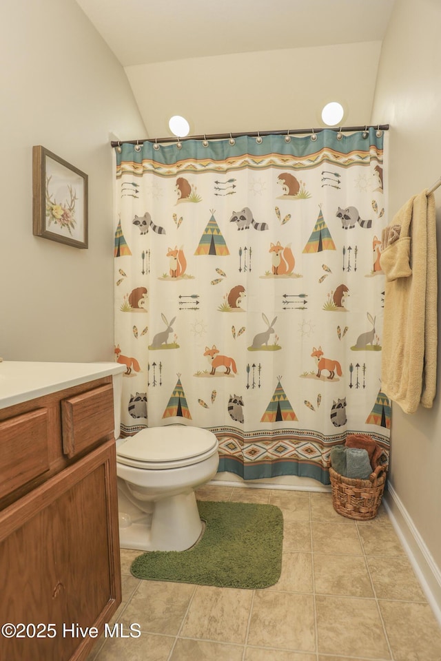 full bath featuring tile patterned flooring, toilet, vanity, vaulted ceiling, and a shower with curtain