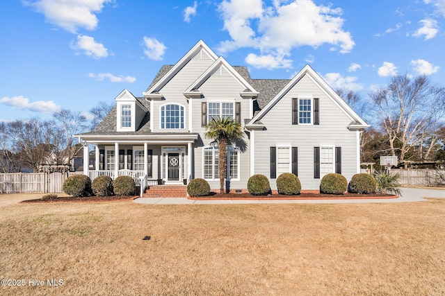 view of front of house featuring a front yard and covered porch