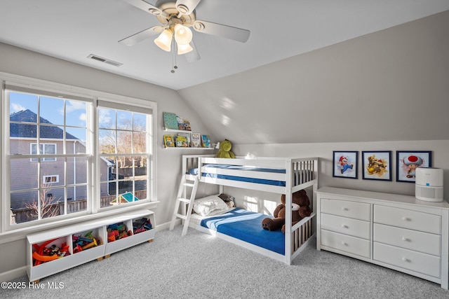 bedroom with carpet floors, ceiling fan, and vaulted ceiling