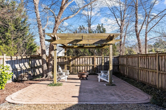 view of patio with a pergola and a fire pit