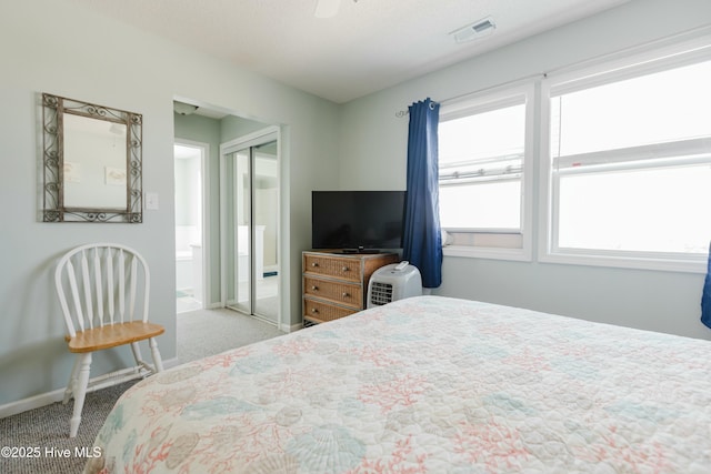 carpeted bedroom with a closet and ceiling fan