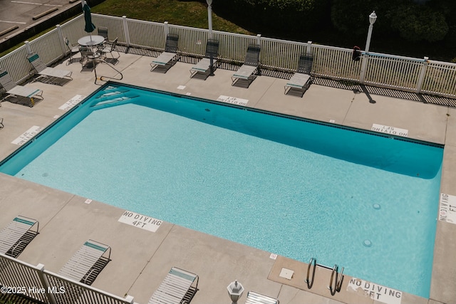 view of swimming pool featuring a patio