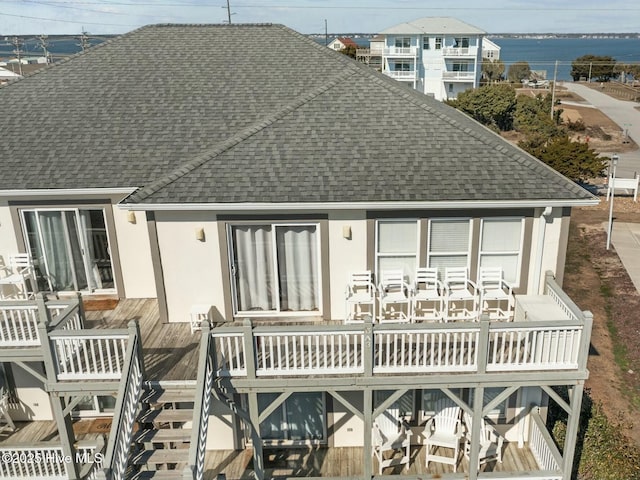 rear view of property with a balcony