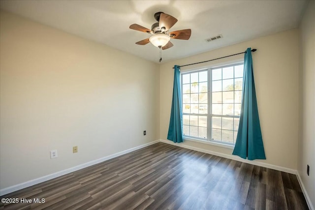 unfurnished room featuring dark hardwood / wood-style floors and ceiling fan