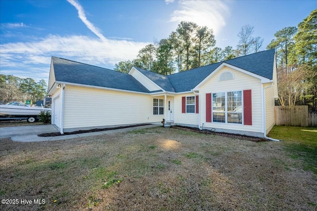 view of front of property featuring a garage and a front yard