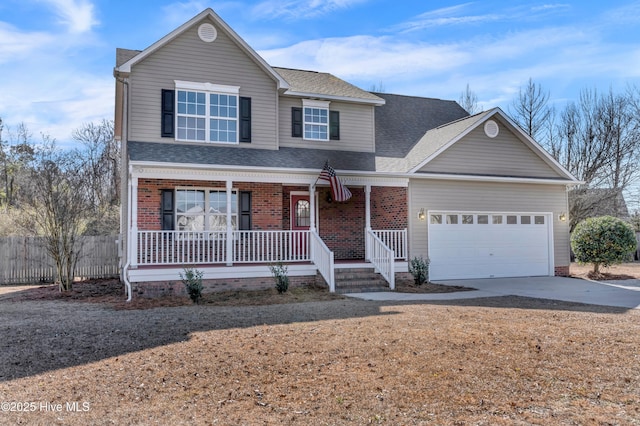 front of property featuring a garage and covered porch