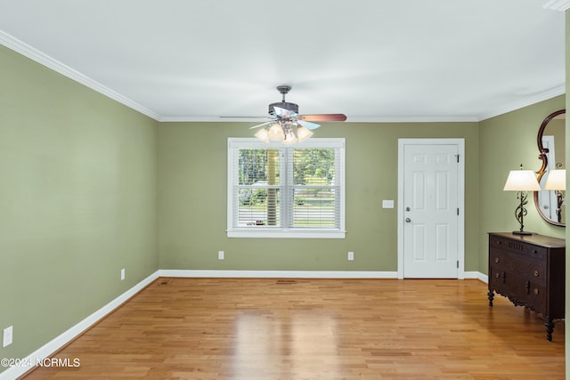 interior space with crown molding, ceiling fan, and light wood-type flooring