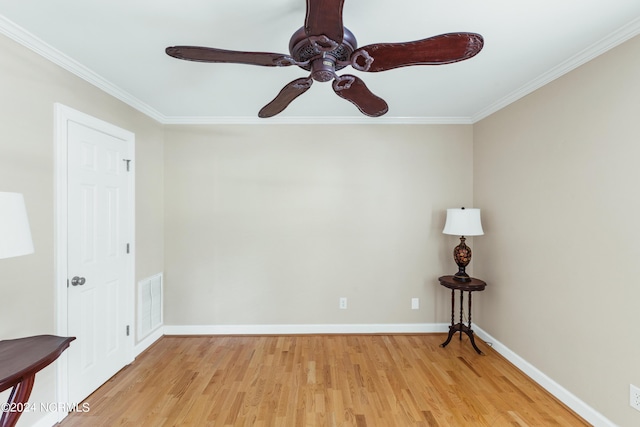 unfurnished room with ornamental molding, ceiling fan, and light hardwood / wood-style flooring