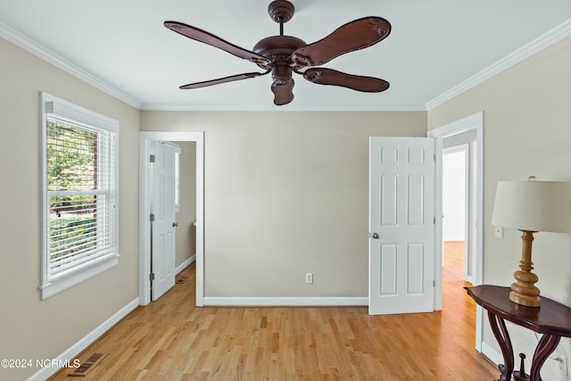 unfurnished bedroom featuring ceiling fan, ornamental molding, and light hardwood / wood-style flooring