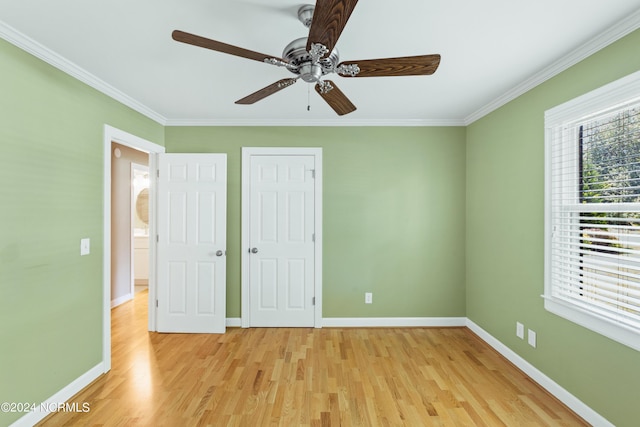 unfurnished bedroom with ornamental molding, ceiling fan, and light hardwood / wood-style flooring