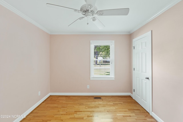 unfurnished room featuring ornamental molding, ceiling fan, and light hardwood / wood-style floors