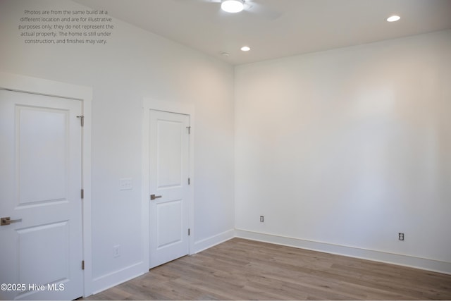 spare room with light wood-type flooring