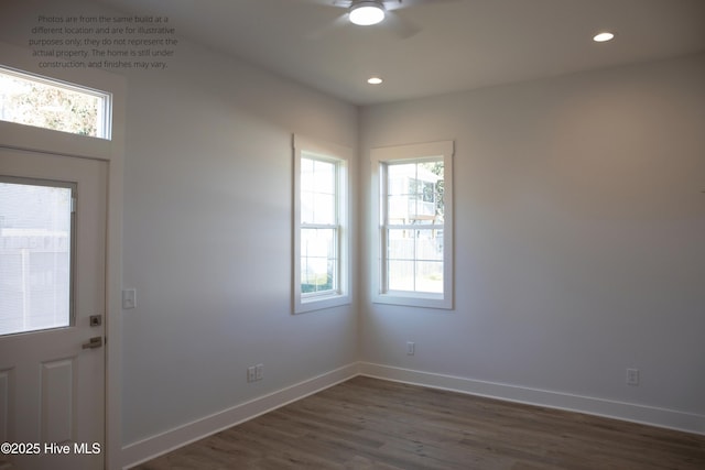 foyer featuring dark wood-type flooring and ceiling fan