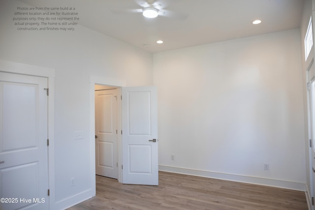 unfurnished bedroom with ceiling fan and light hardwood / wood-style floors