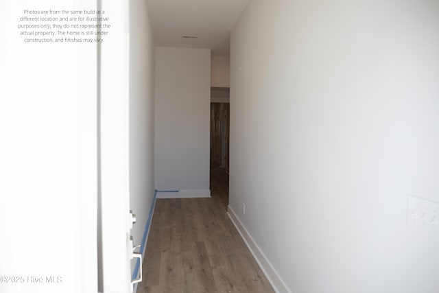 hallway featuring hardwood / wood-style flooring