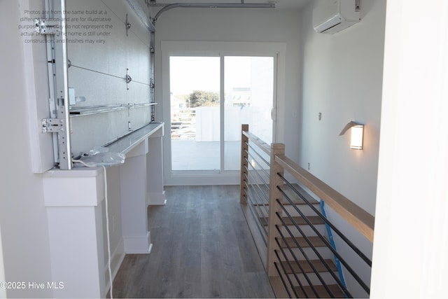 hall featuring dark hardwood / wood-style floors and a wall mounted AC