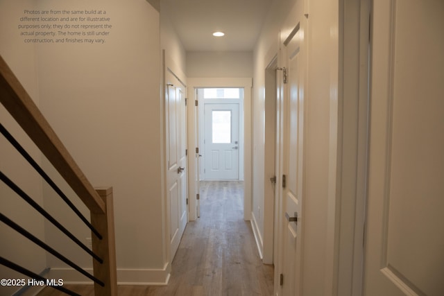 hallway with light wood-type flooring