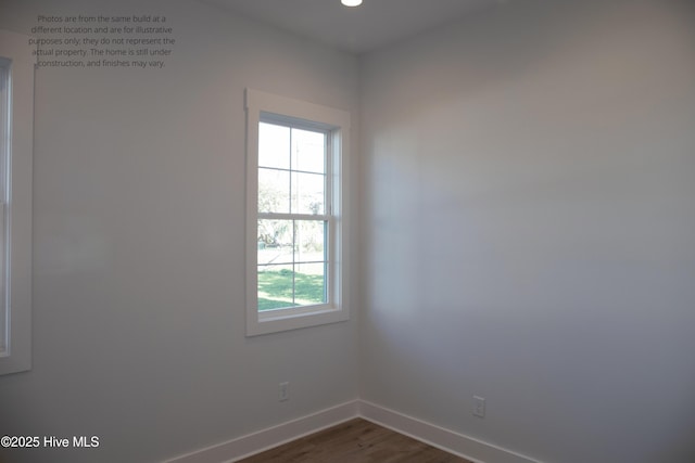 empty room with dark hardwood / wood-style floors