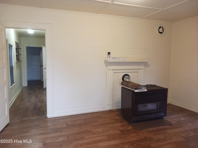 details featuring hardwood / wood-style flooring and a wood stove